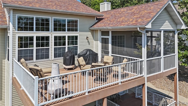 deck with a sunroom