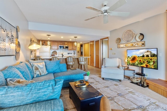 living room featuring ceiling fan