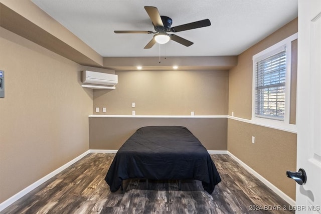 bedroom featuring an AC wall unit, ceiling fan, and dark wood-type flooring