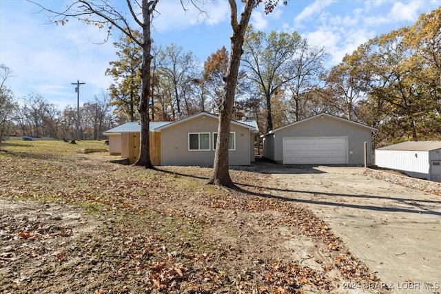 view of home's exterior featuring a garage and an outdoor structure