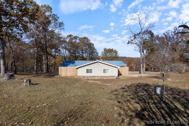 view of property exterior with a lawn