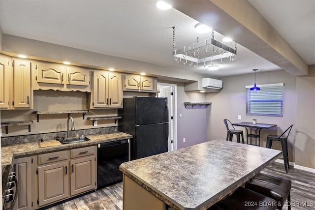 kitchen featuring black appliances, an AC wall unit, sink, a kitchen island, and dark hardwood / wood-style flooring