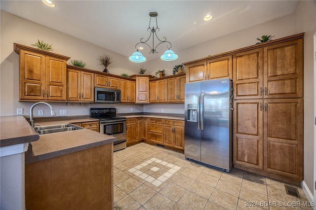 kitchen featuring sink, decorative light fixtures, light tile patterned floors, appliances with stainless steel finishes, and a notable chandelier