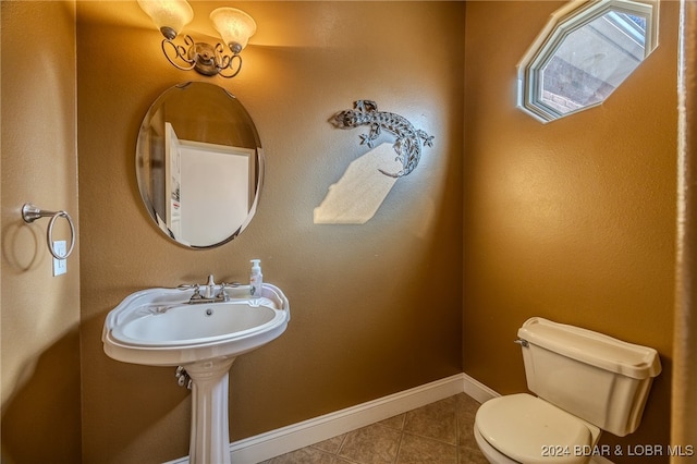 bathroom featuring tile patterned floors and toilet