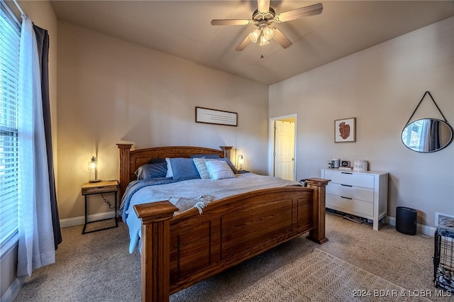 bedroom with ceiling fan and light colored carpet