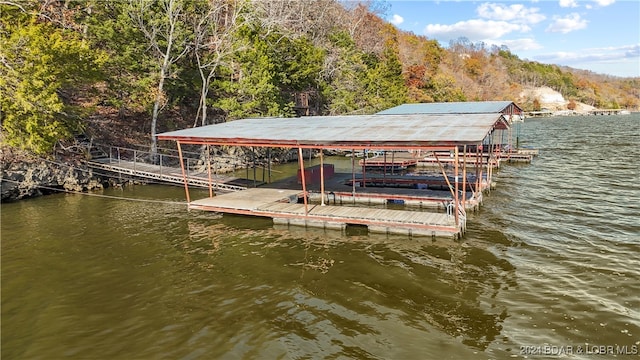 dock area featuring a water view