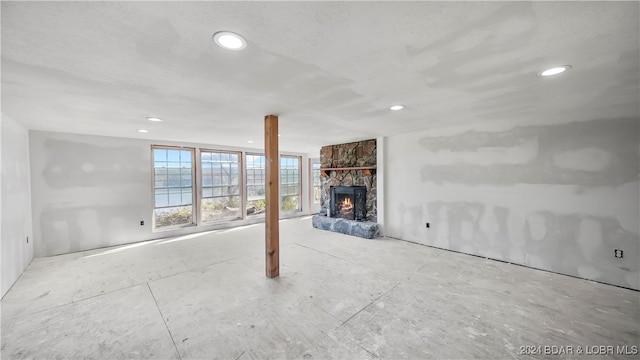 unfurnished living room with a fireplace