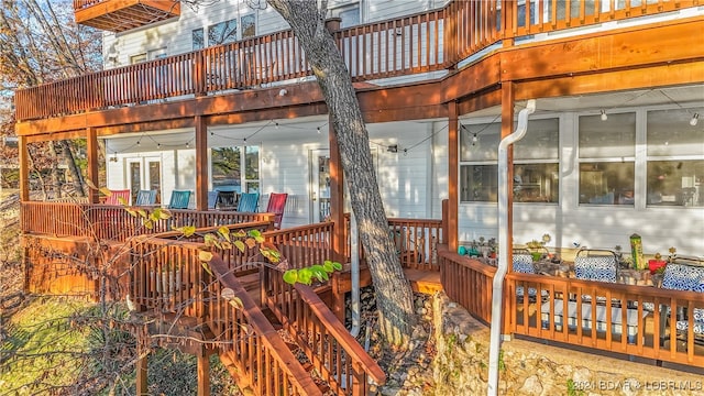 wooden deck featuring a sunroom