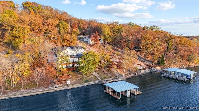 birds eye view of property with a water view