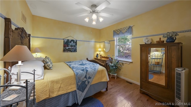 bedroom featuring ceiling fan and wood-type flooring