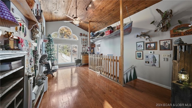 hallway featuring hardwood / wood-style floors, wood ceiling, and vaulted ceiling