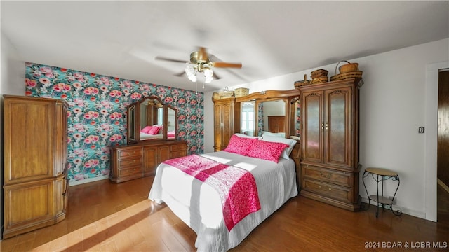 bedroom with ceiling fan and wood-type flooring