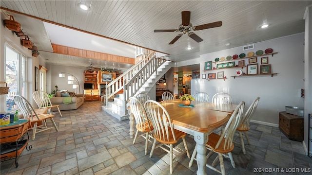 dining room with ceiling fan and wooden ceiling