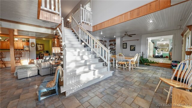 staircase with ceiling fan