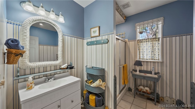 bathroom with tile patterned floors and vanity