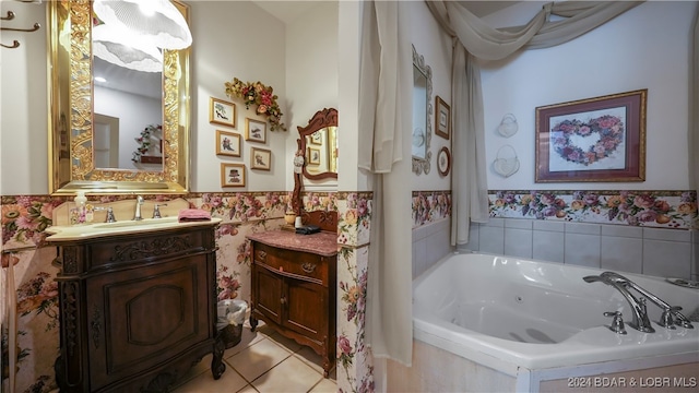 bathroom with vanity, a relaxing tiled tub, and tile patterned floors