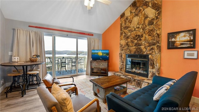 2500 Bay Point Ln Unit 645, Osage Beach, MO 65065 - living area featuring wood finished floors, a ceiling fan, a fireplace, baseboards, and high vaulted ceiling