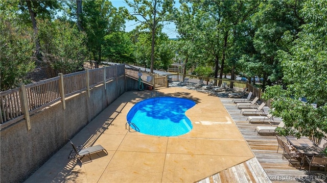 2500 Bay Point Ln Unit 645, Osage Beach, MO 65065 - community pool featuring a fenced backyard, a wooden deck, and a patio
