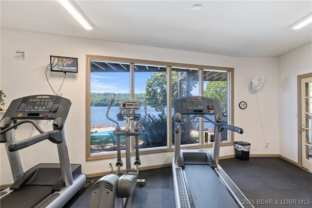 2500 Bay Point Ln Unit 645, Osage Beach, MO 65065 - exercise room featuring baseboards and a water view