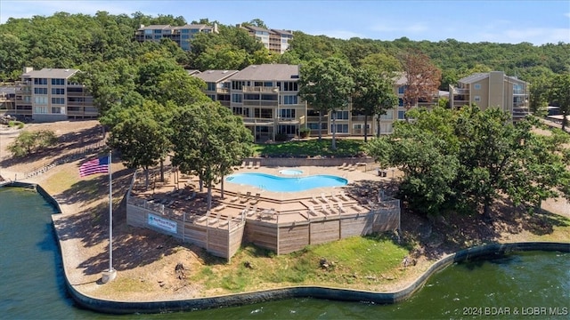 birds eye view of property with a water view