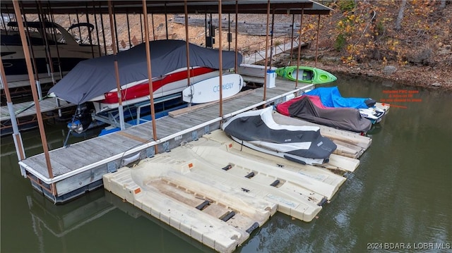 2500 Bay Point Ln Unit 645, Osage Beach, MO 65065 - dock area with boat lift and a water view