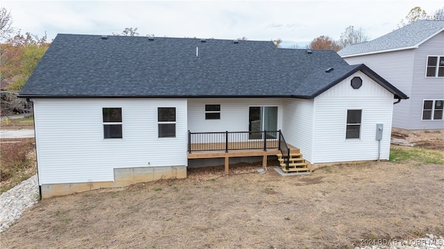 back of house featuring a wooden deck