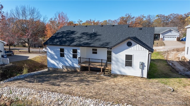 back of property with a wooden deck