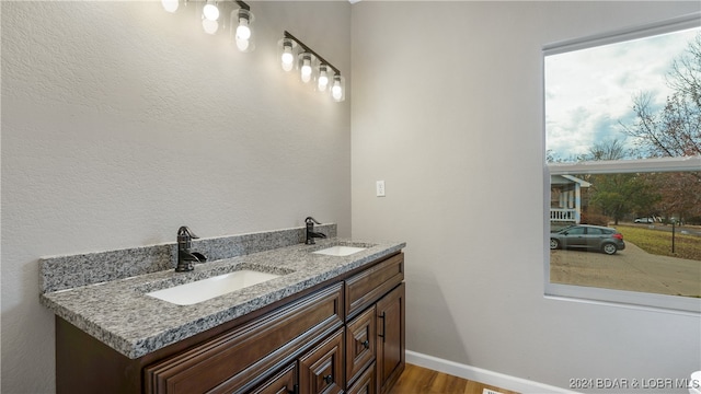 bathroom featuring hardwood / wood-style floors and vanity