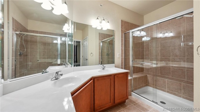 bathroom with a sink and a stall shower