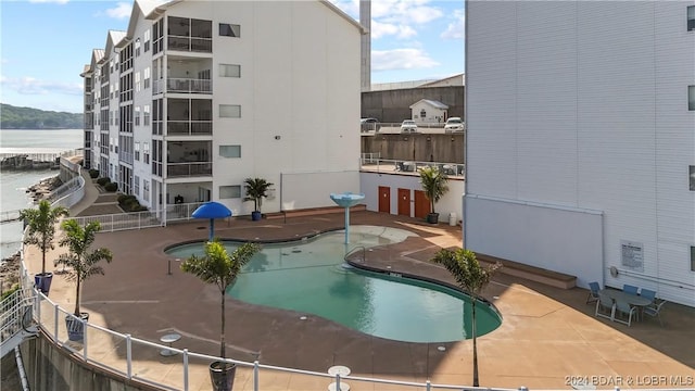 60 Knox Rd Unit Z204, Rocky Mount, MO 65072 - community pool featuring a patio area and a water view