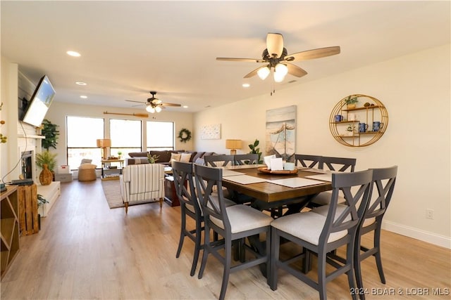 dining room featuring light wood-type flooring and ceiling fan