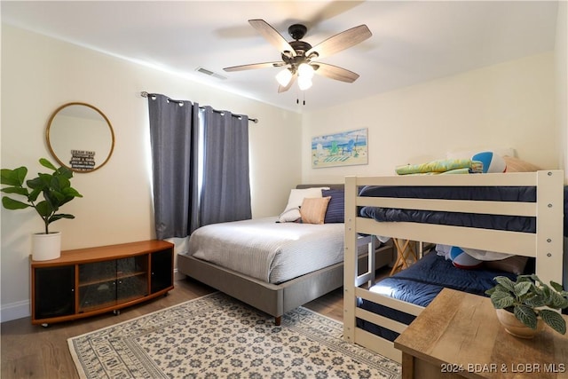 bedroom featuring wood-type flooring and ceiling fan