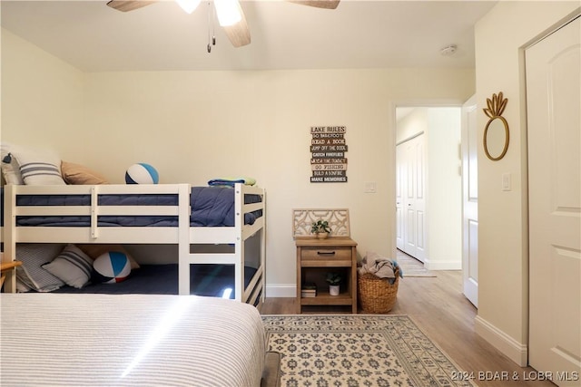 bedroom featuring light hardwood / wood-style floors and ceiling fan