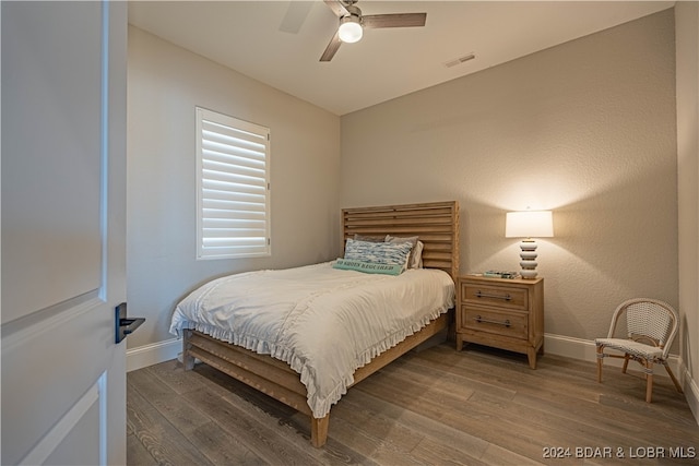 bedroom with wood-type flooring and ceiling fan