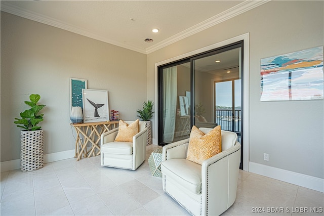 sitting room featuring crown molding and light tile patterned flooring