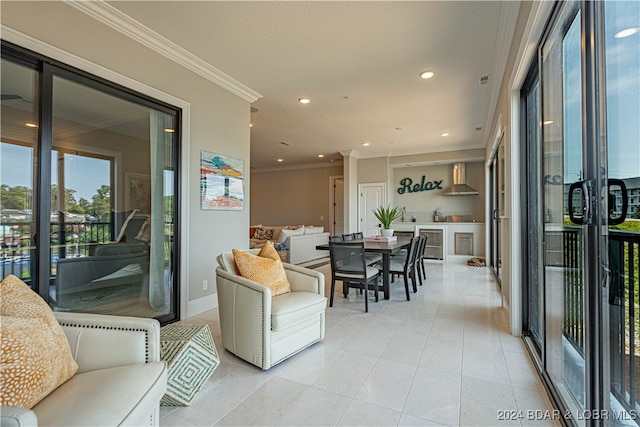 living room featuring light tile patterned floors and ornamental molding