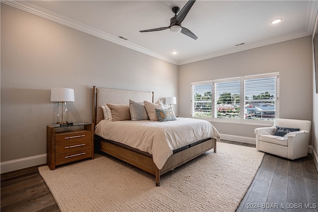 bedroom featuring ceiling fan, crown molding, and dark wood-type flooring