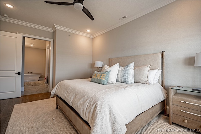 bedroom with hardwood / wood-style flooring, ceiling fan, and ornamental molding