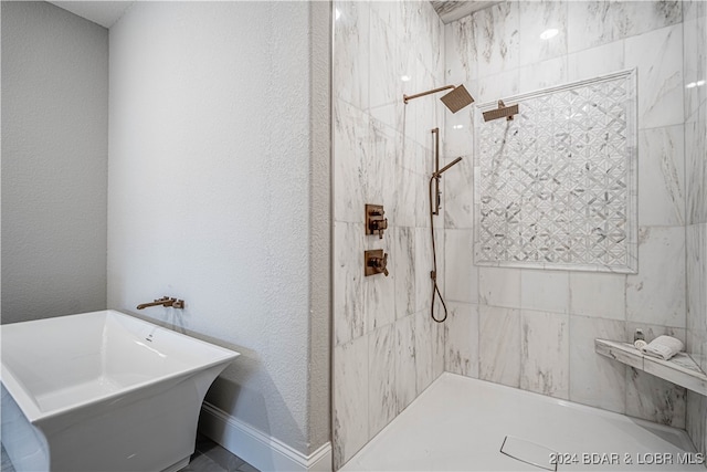 bathroom with shower with separate bathtub