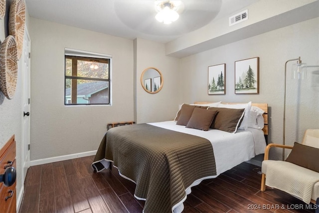 bedroom featuring dark hardwood / wood-style flooring and ceiling fan