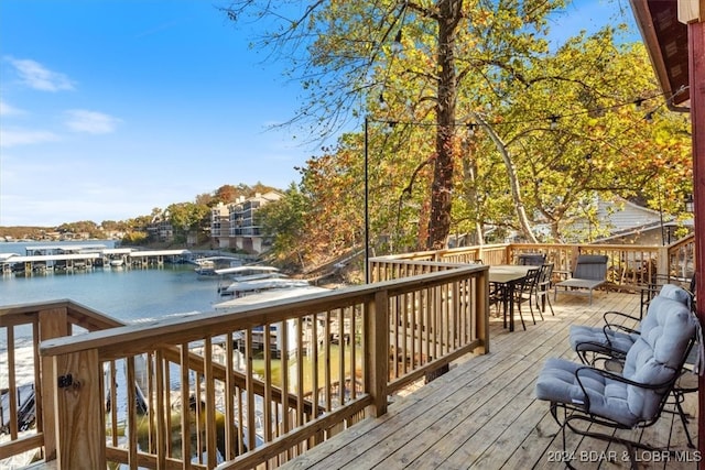 wooden deck featuring a water view