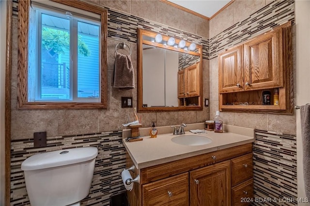 half bath with backsplash, tile walls, toilet, and vanity