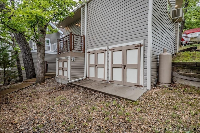 view of property exterior with a storage shed