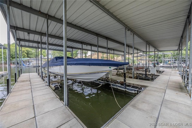 view of dock featuring a water view and boat lift