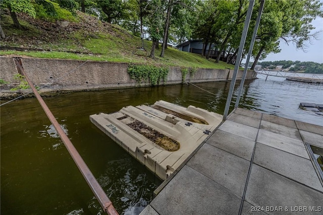 dock area featuring a water view