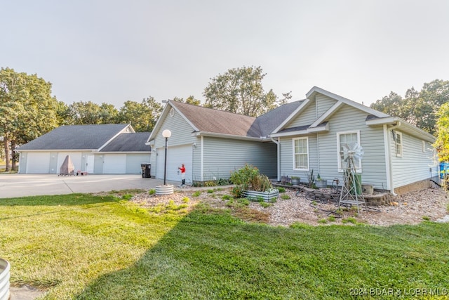 view of front of home with a garage and a front yard