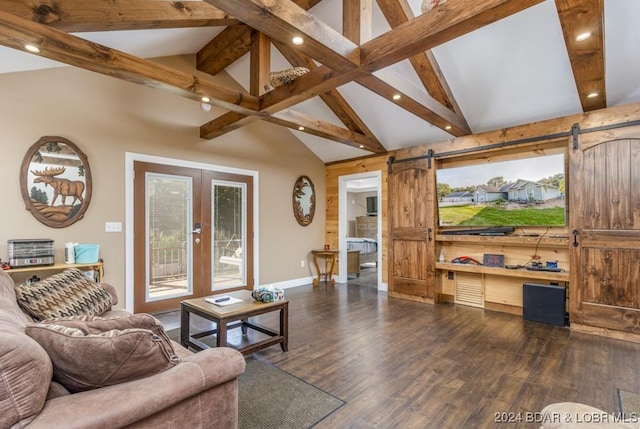 living room featuring lofted ceiling with beams, a barn door, and dark hardwood / wood-style floors