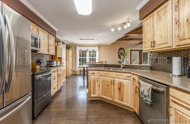 kitchen featuring light brown cabinets, backsplash, appliances with stainless steel finishes, stone countertops, and kitchen peninsula