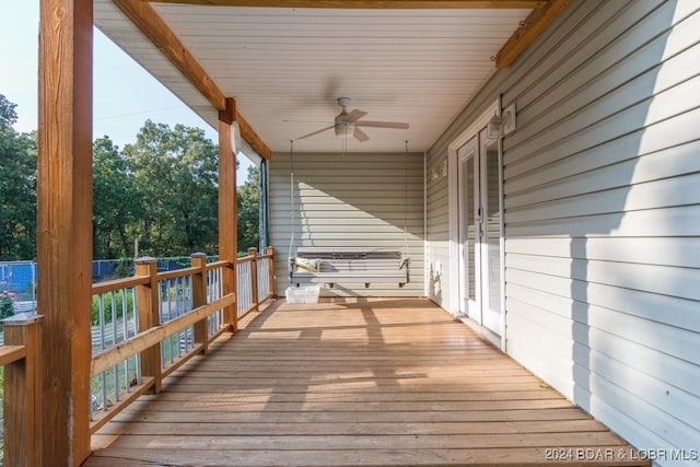 wooden terrace featuring ceiling fan