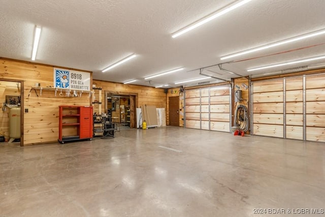 garage featuring wood walls